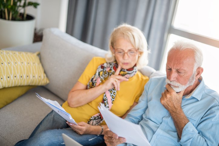 A senior couple trying to figure out how to pay for retirement expenses.