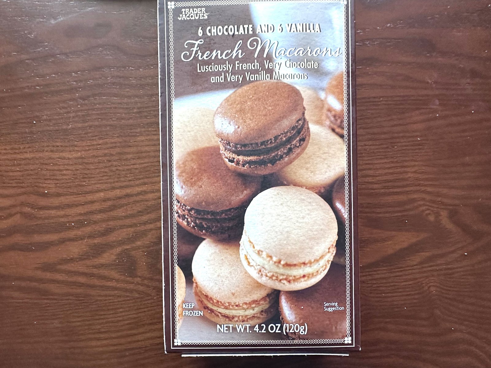A box of Trader Joe's chocolate and vanilla French macarons.