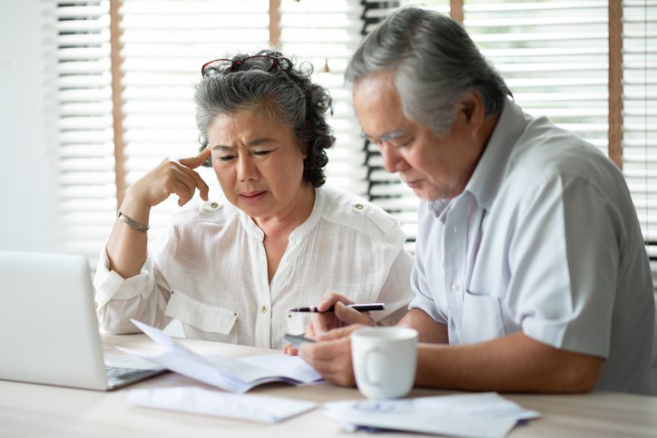 A senior couple reviewing benefit changes under the One Big Beautiful Act.