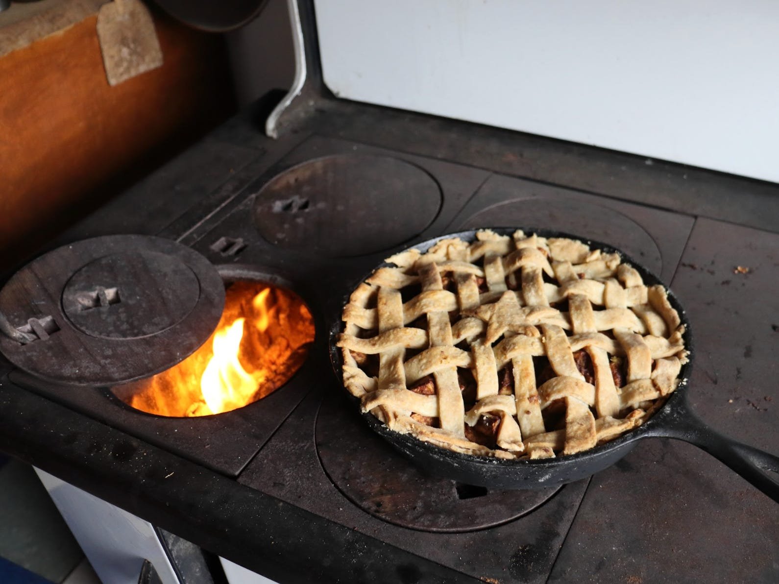 Making a pie on the woodstove.