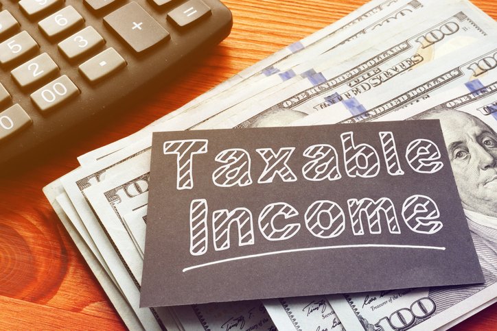 Taxable income is your AGI minus deductions and adjustments, and it’s the number the IRS uses to calculate your tax bill.