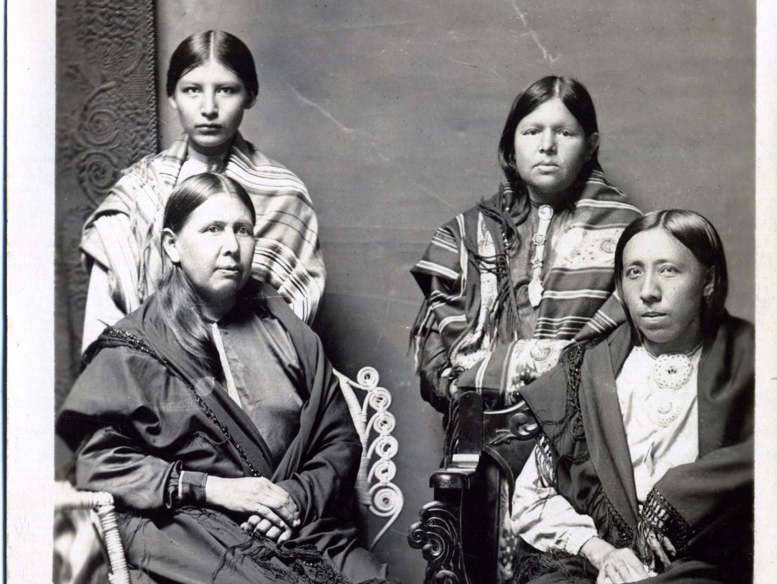 A portrait of an Osage woman and her three children circa 1918-1922.