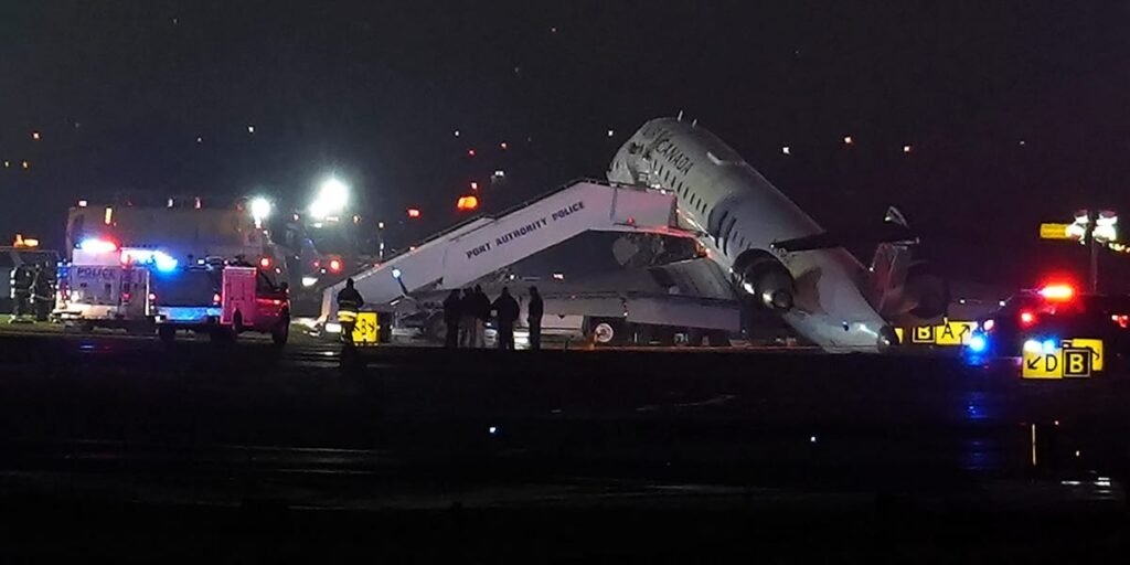 The front of an Air Canada plane was wrecked at LaGuardia after it collided with a vehicle while taxiing