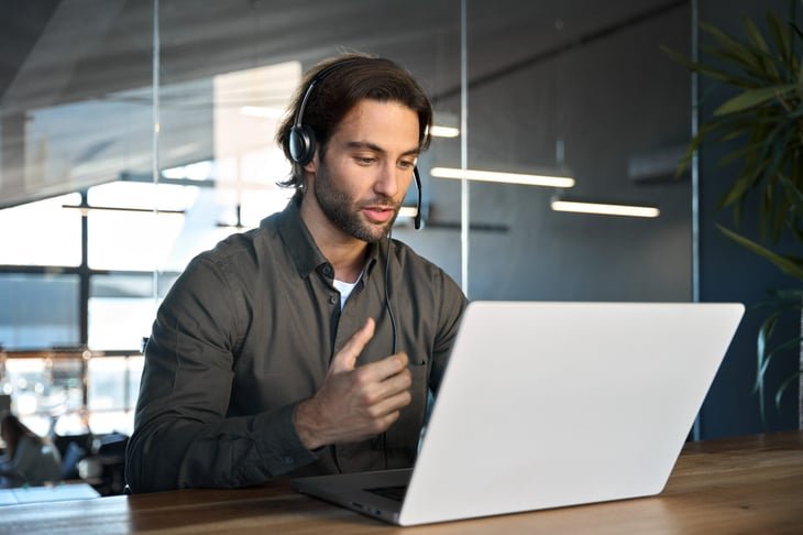 Man making a call on a headset.