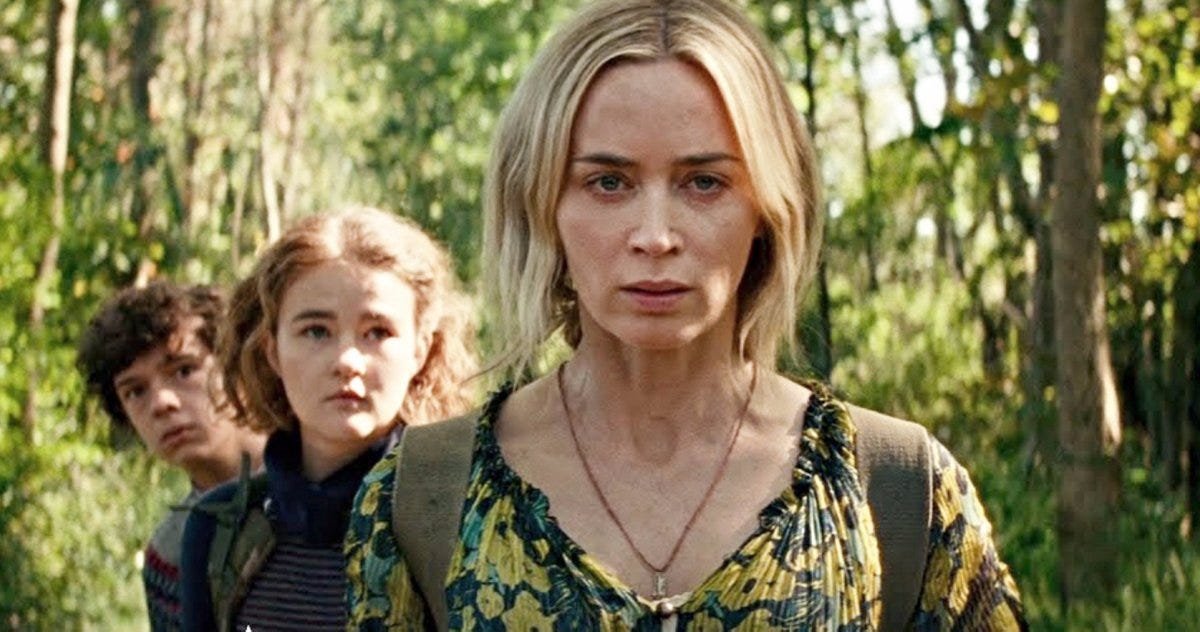 Noah Jupe, Millicent Simmonds and Emily Blunt in a forrest in A Quiet Place Part II