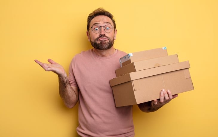 questioning man with packages