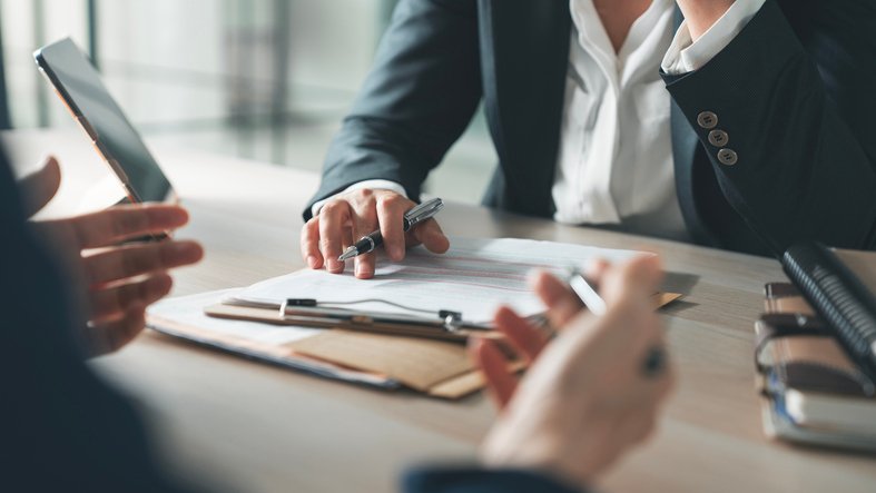 An advisor reviews a client's annuity contract.