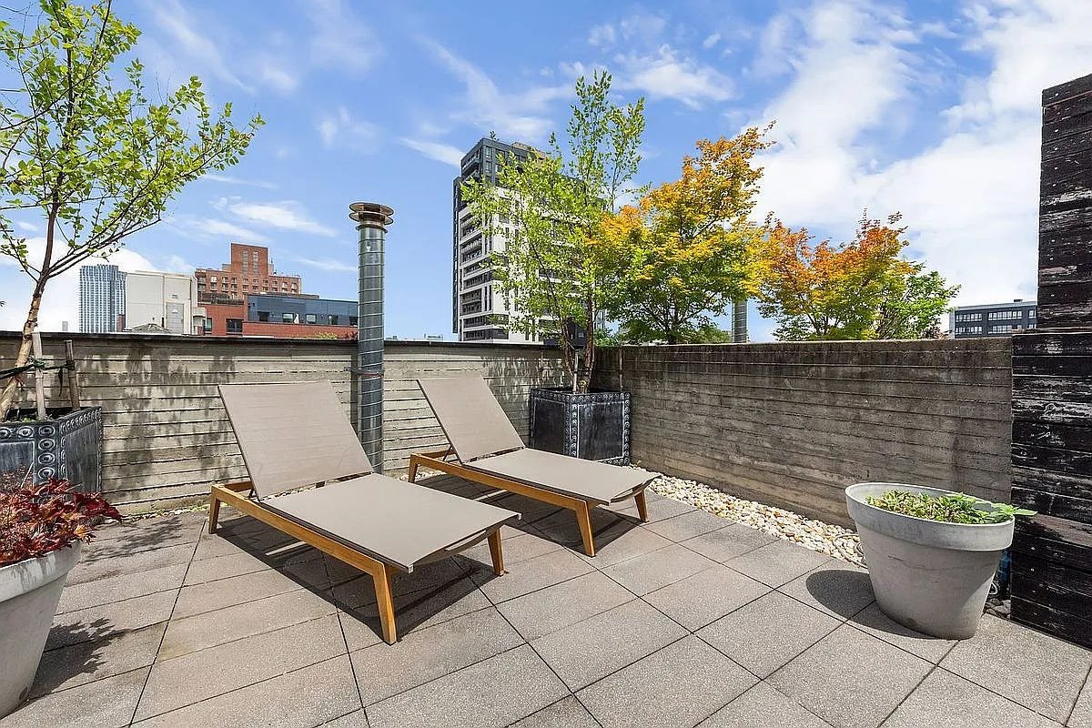The rooftop patio of 3 Wythe LN in Brooklyn, a home listed with Anthropic shares as a buying option.