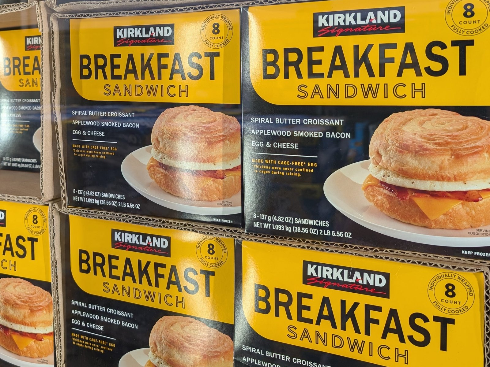 Several boxes of Kirland Signature breakfast sandwiches.