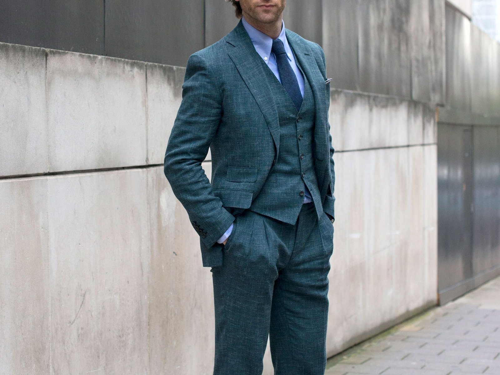 A man wearing a three-piece suit.