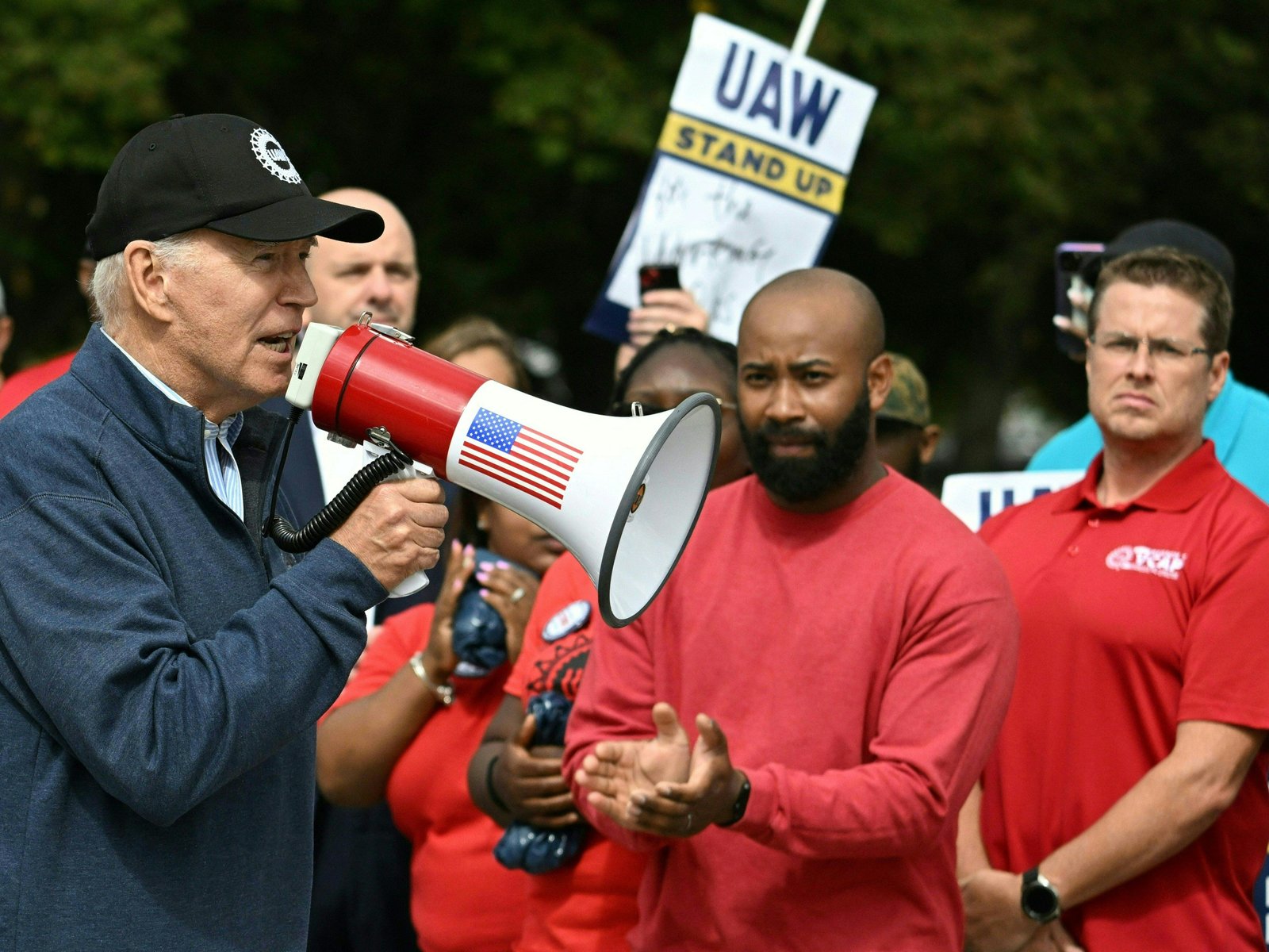 Joe Biden holding megaphone on UAW picket line