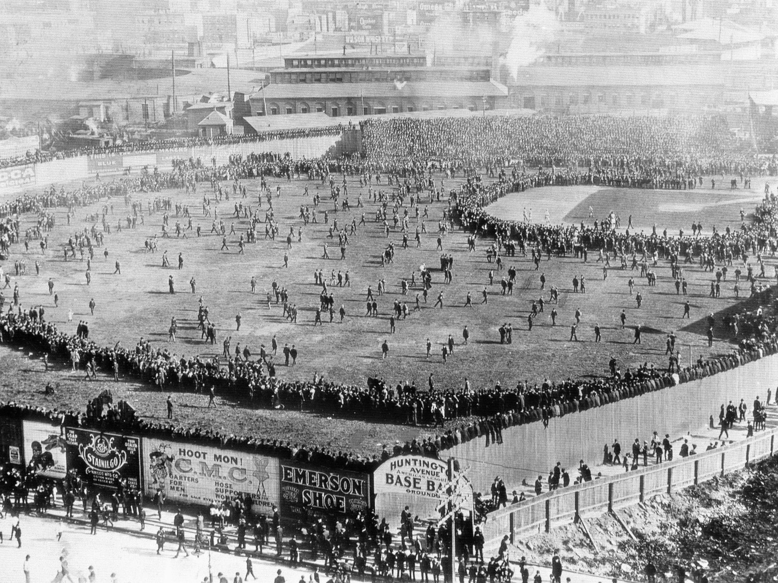 people crowding the field during the first World Series