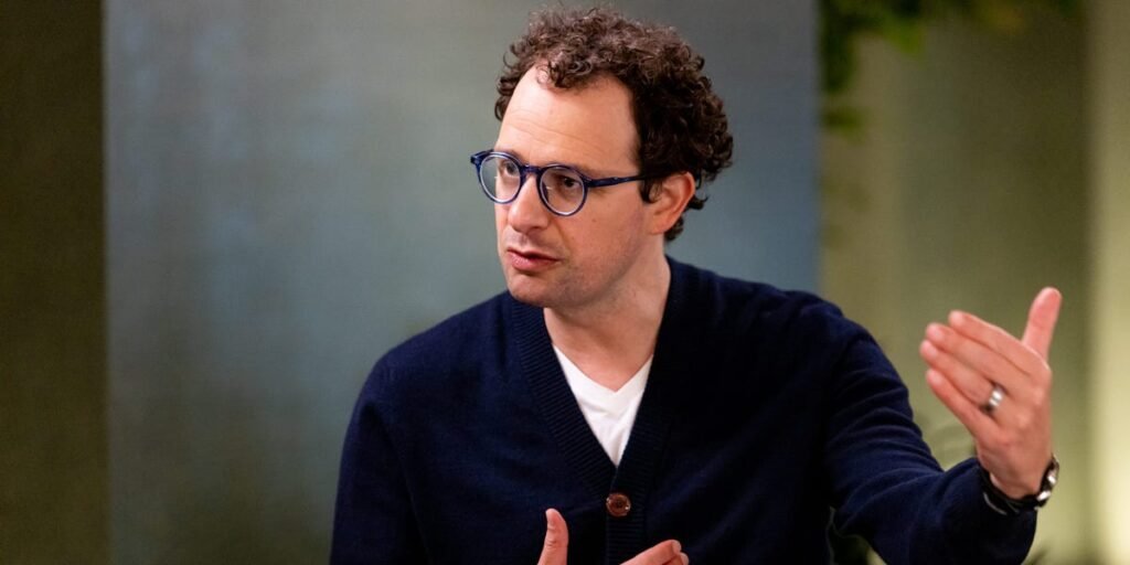 Anthropic CEO says an ‘intrinsic’ feature of AI may be fewer jobs. His answer? Redistribute the upside.