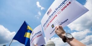 Transgender US troops can continue serving for now, in a major reversal for Trump