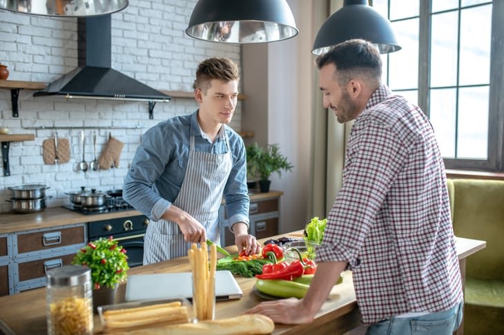 Man chopping vegetables in the kitchen