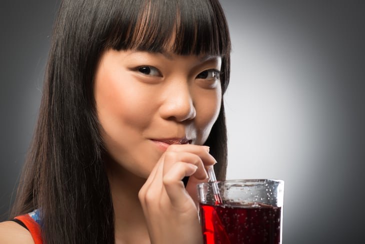 Woman drinking fruit juice