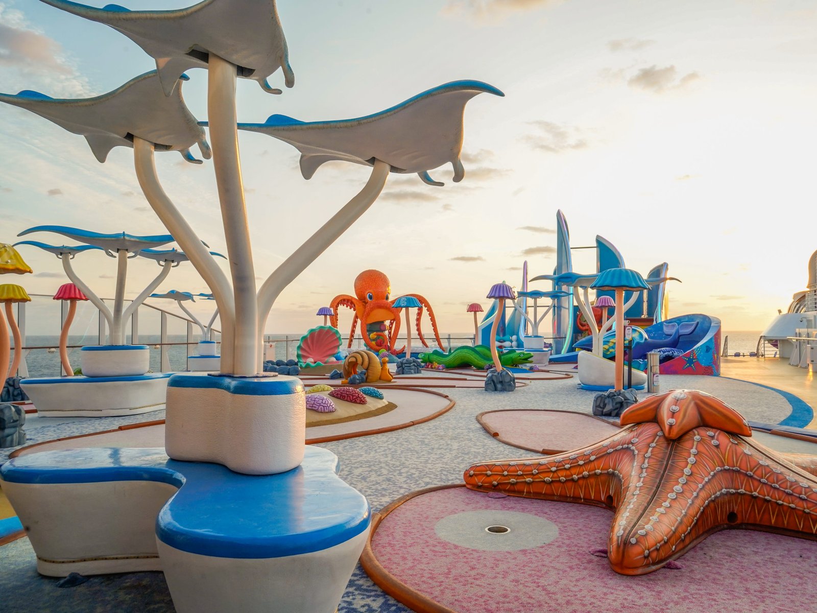 An empty mini golf course with a sea creature theme on a cruise ship