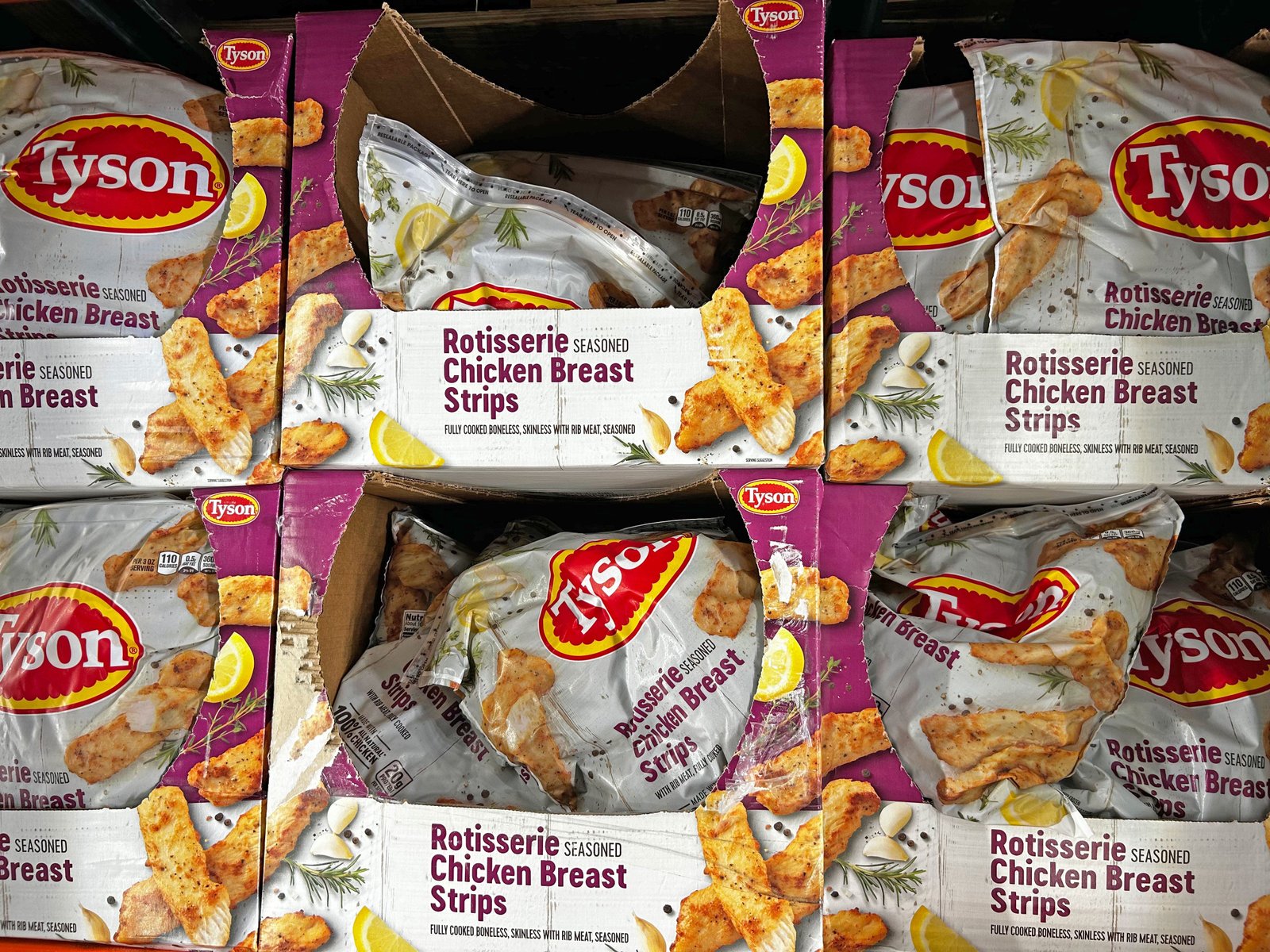 Bags of Tyson rotisserie chicken breast strips.