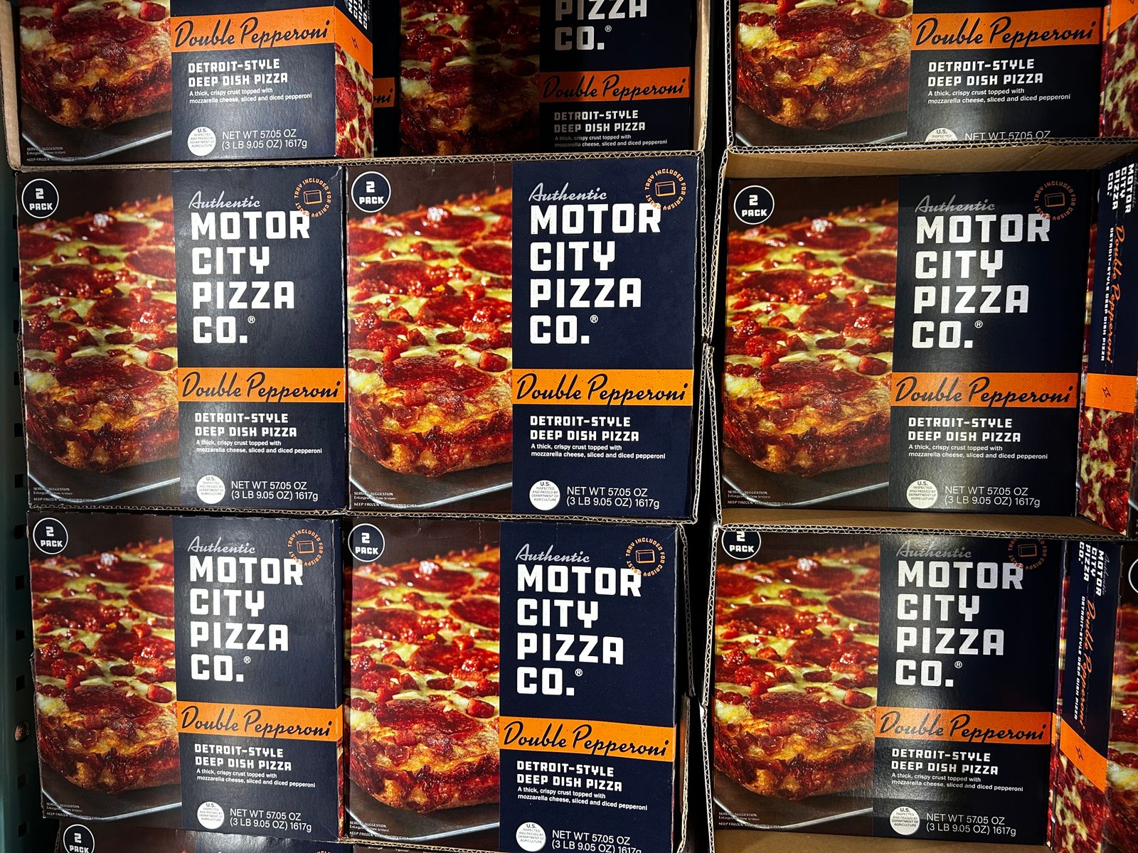 Boxes of Motor City Pizza Co. pepperoni pizza.