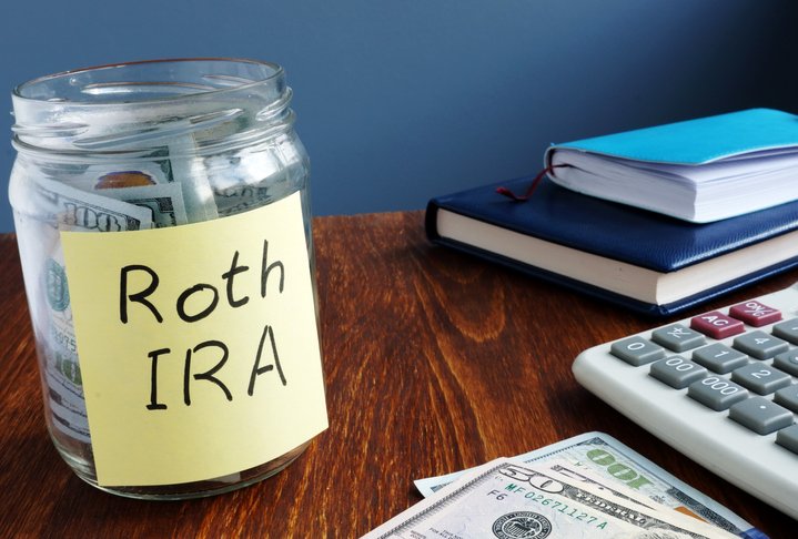 A jar of money labeled "Roth IRA."