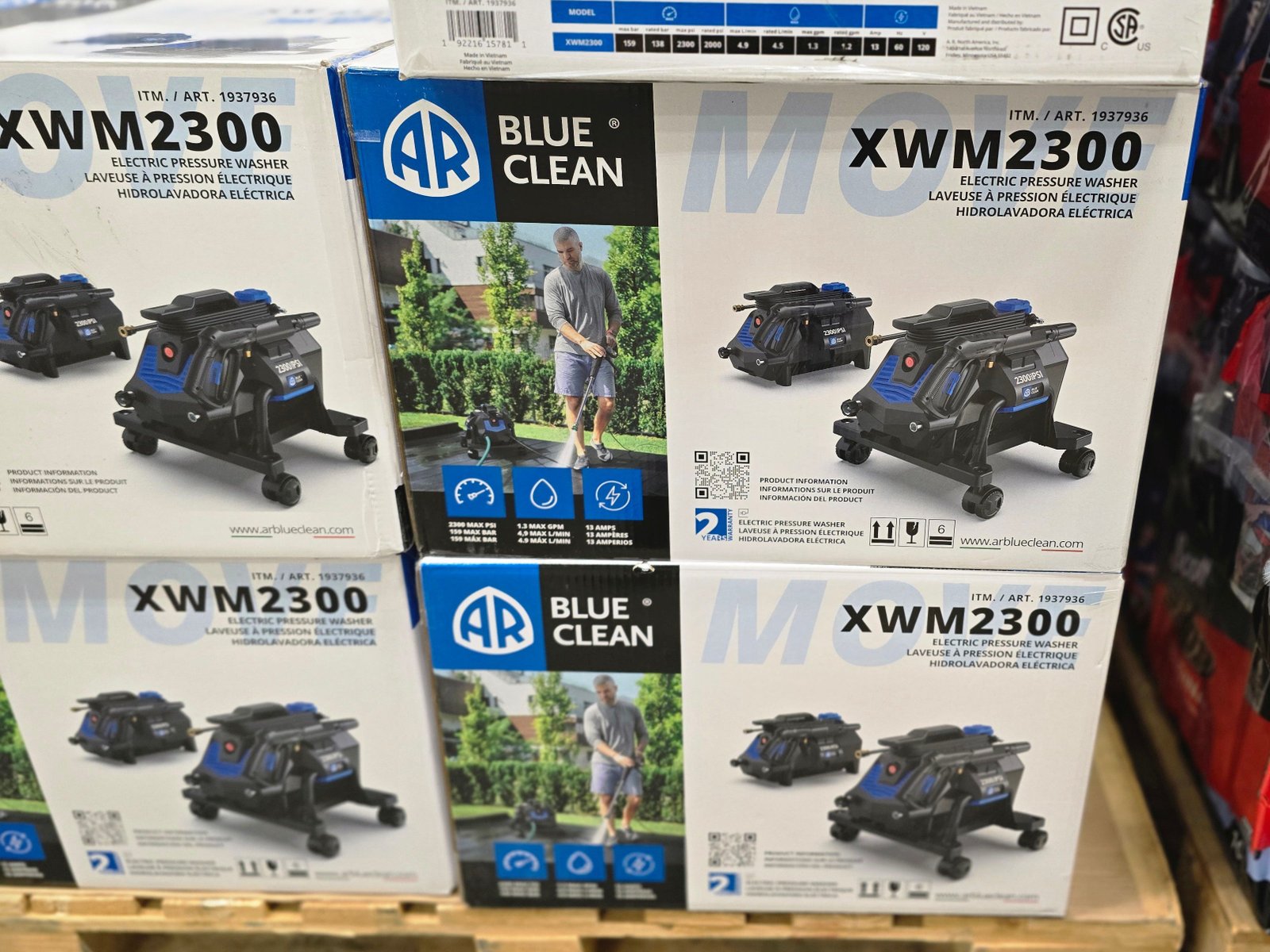 Boxes of AR Blue Clean electric pressure washers on display at Costco.