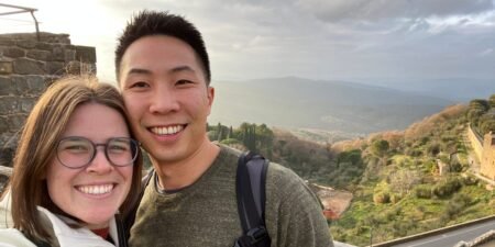 My husband and I both want to move abroad. We just can’t agree on how much money we should save first.